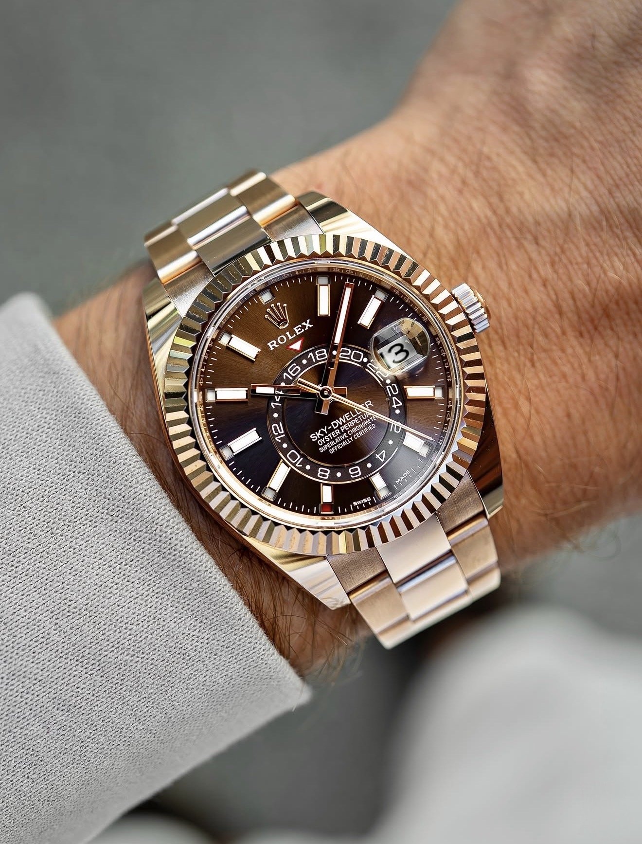 Rolex Sky-Dweller in Everose gold worn on wrist