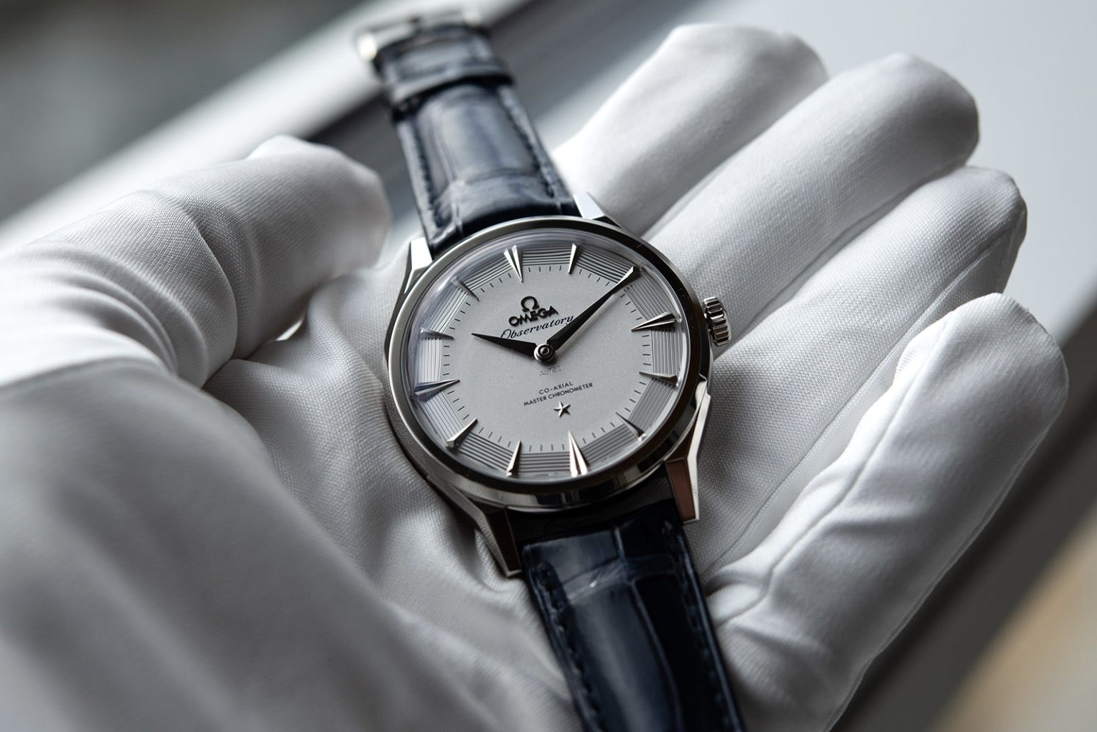 Omega Observatory on white gloves